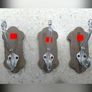 3-Silver Wall Hooks on Grey Wood